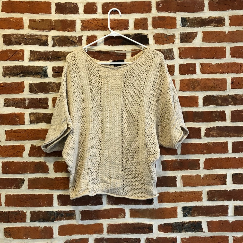 Quarter-length, oversized cable knit sweater